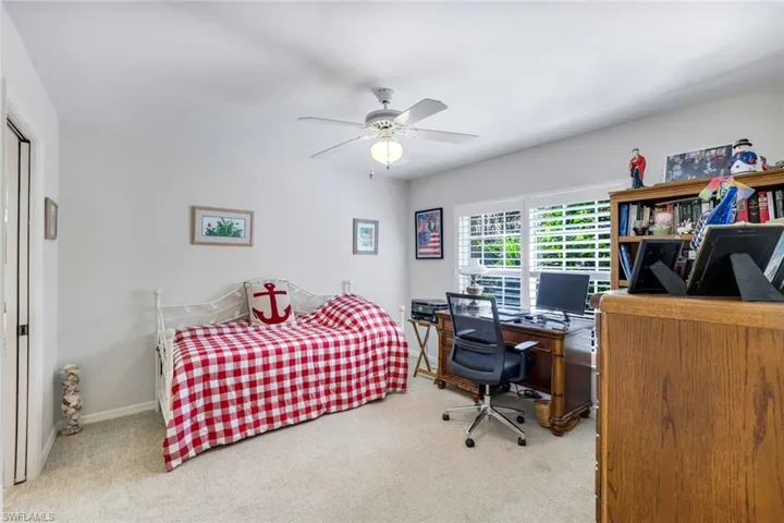 Bedroom featuring carpet floors, ceiling fan, and baseboards