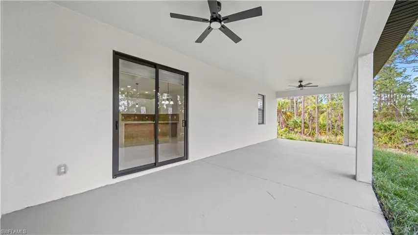 View of patio featuring a ceiling fan
