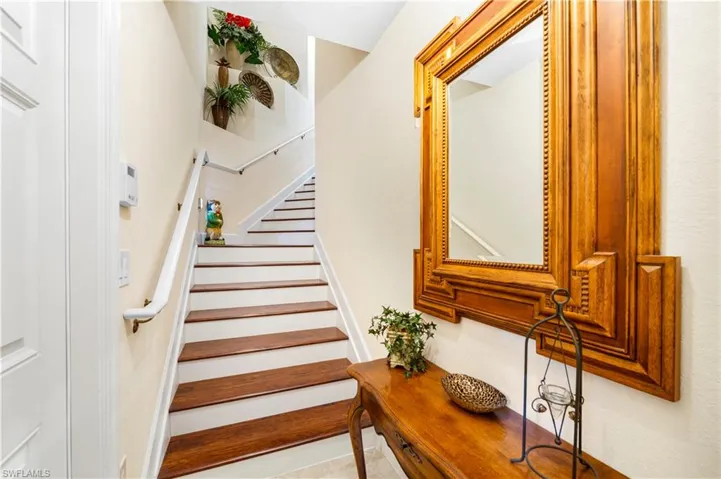 Staircase with tile patterned floors