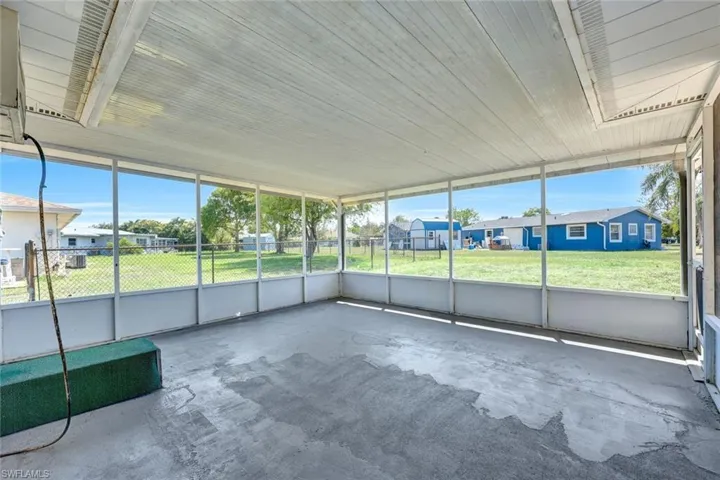Unfurnished sunroom with a residential view