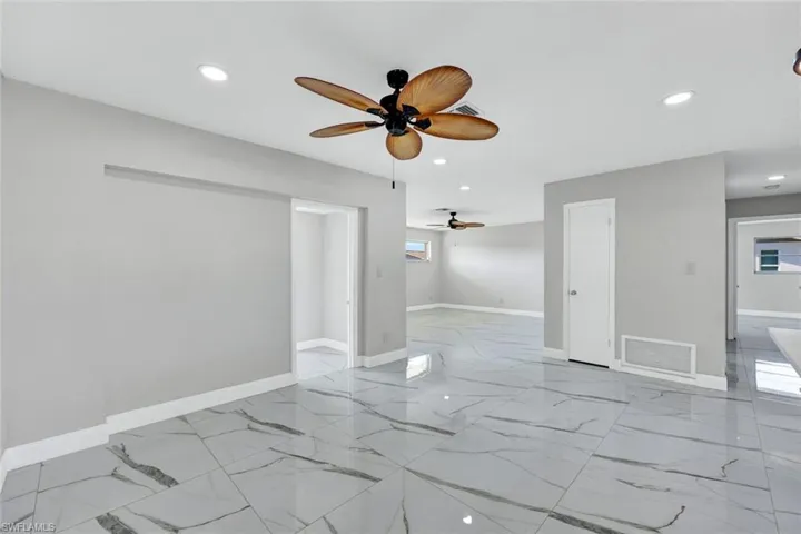 Spare room with visible vents, a ceiling fan, and recessed lighting
