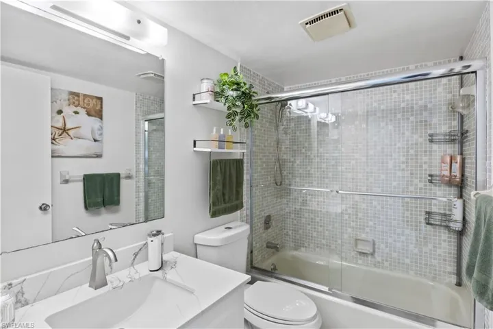Guest bathroom with tub/shower combination.