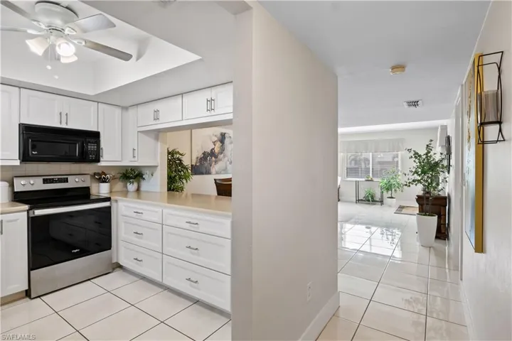 This home has an open floor plan that allows you to chat with guests in the dining area while you cook in the kitchen.