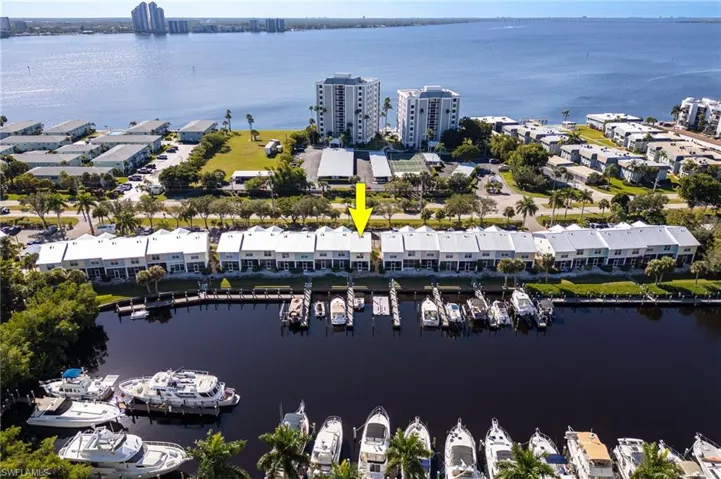 Waterfront townhome featuring a private dock and direct water access