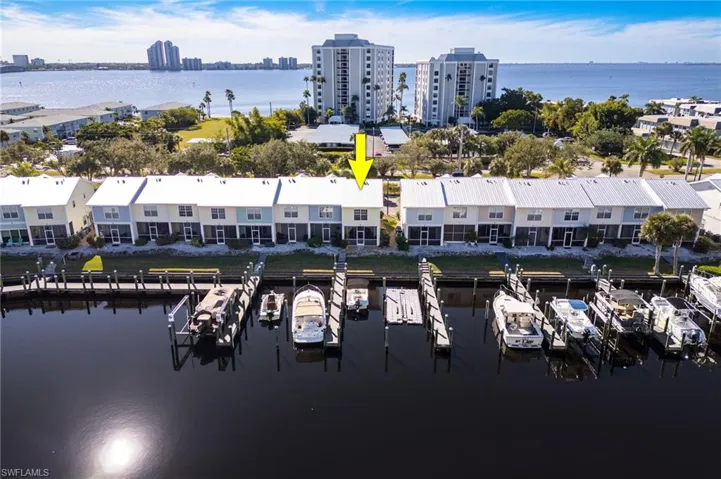 Waterfront townhome with a private boat slip, dock access, and direct water frontage