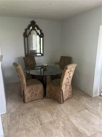 Dining area featuring a textured ceiling