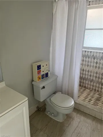 Full bathroom featuring vanity and a stall shower