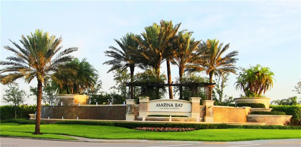 Community / neighborhood sign featuring a yard