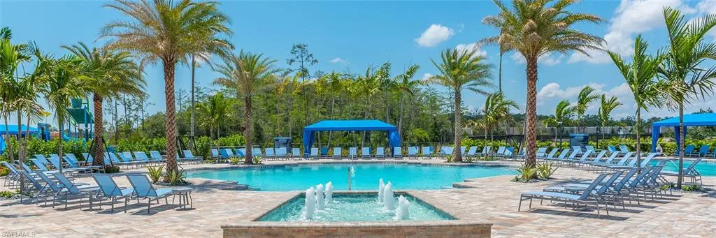 View of pool featuring pool water feature and a patio area