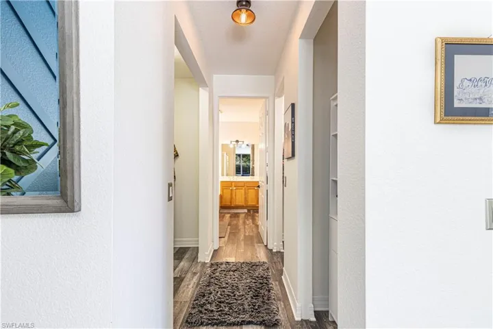Corridor featuring hardwood / wood-style floors