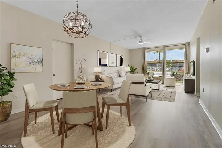 Dining space featuring ceiling fan and light wood-type flooring