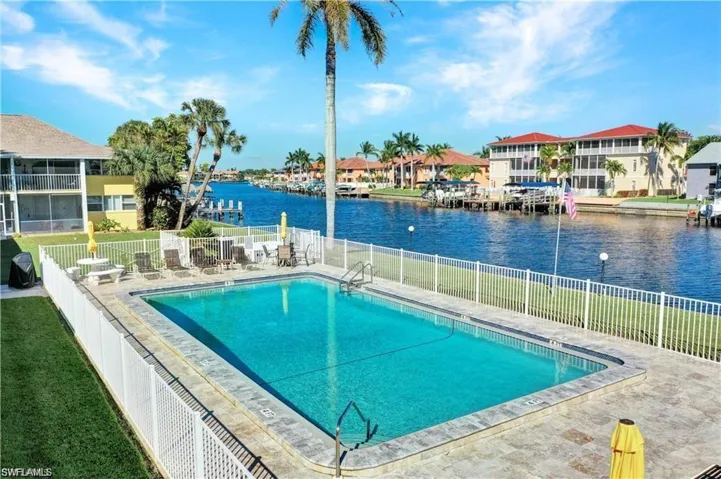 View of pool with a water view