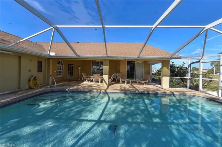 arge swimming pool and screened cage