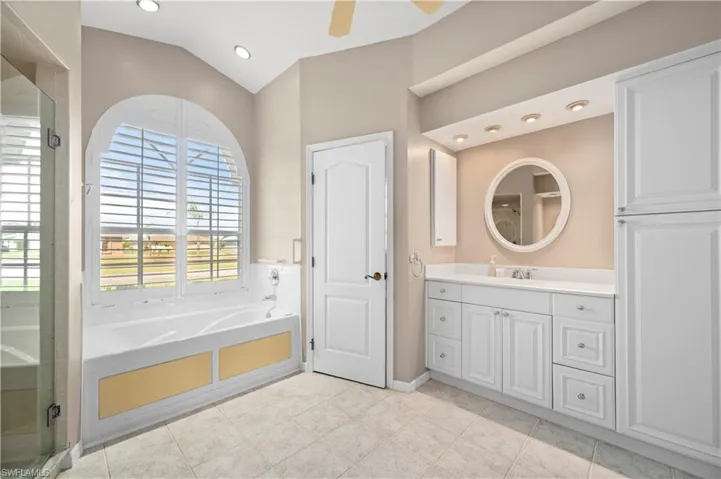 Master Bathroom with built-in storage cabinets, W/C, jetted tub