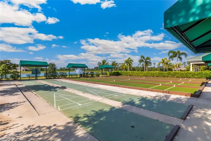 The property features shuffleboard courts and a bocce ball court, complete with shaded seating areas