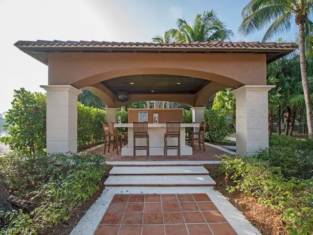 Doorway to property featuring a bar