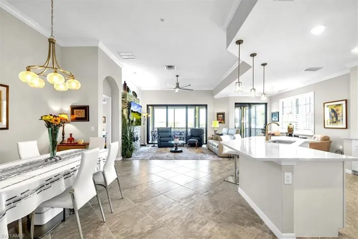 View from hallway looking into main living area and kitchen