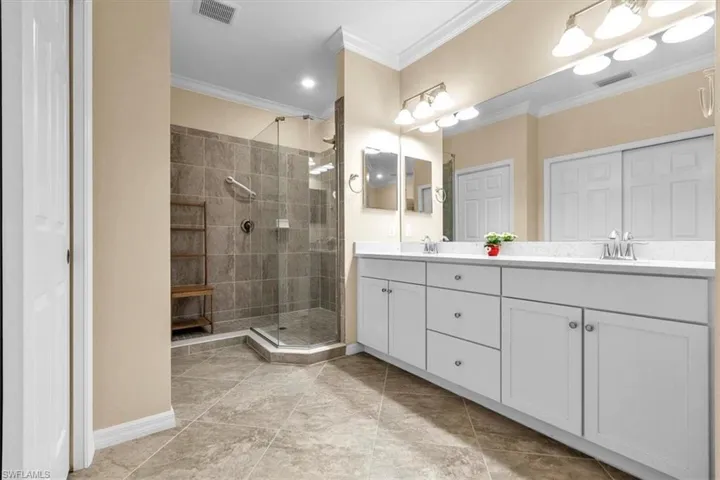 Tile shower, dual sinks - lots of space