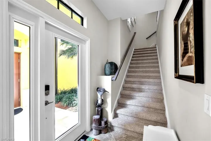 Stairs going from front door to main living area
