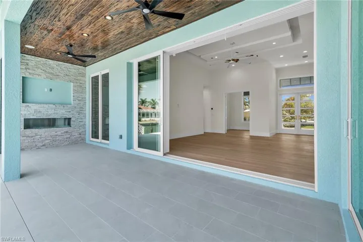 View of patio / terrace with french doors and ceiling fan