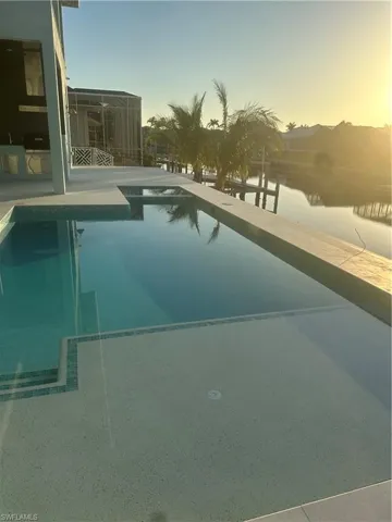 Pool at dusk with an outdoor pool