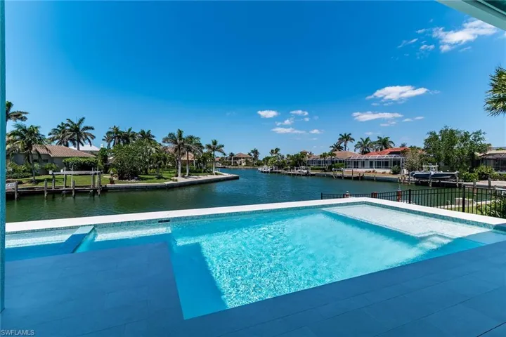 View of swimming pool featuring a water view