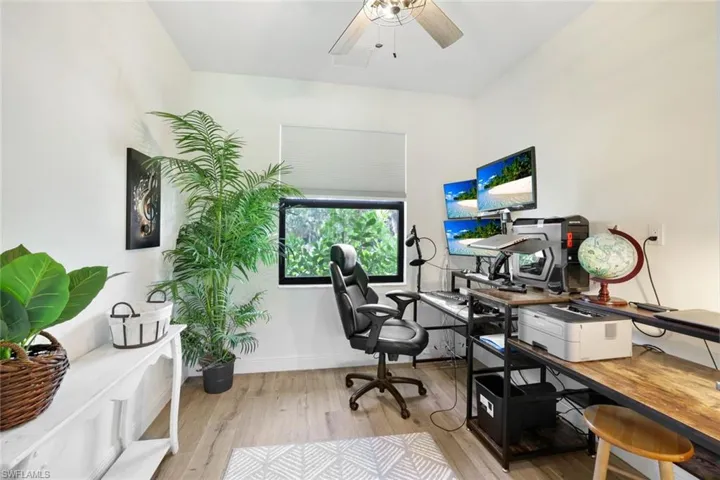 Office featuring ceiling fan and light wood-type flooring