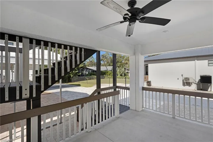 View of patio / terrace featuring ceiling fan and cooling unit