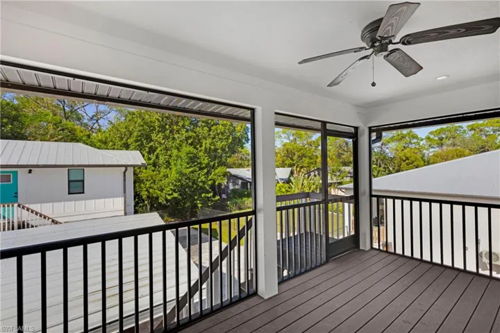 Sunroom / solarium featuring ceiling fan