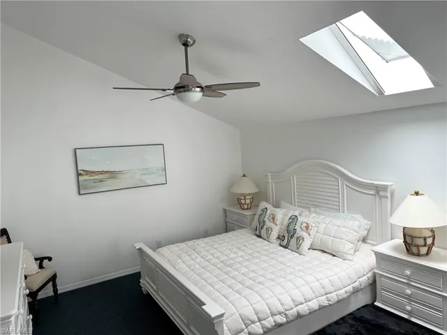 King bed,  lofted ceiling, skylight and ceiling fan