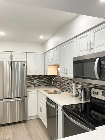 Kitchen with stainless appliances and quartz countertops