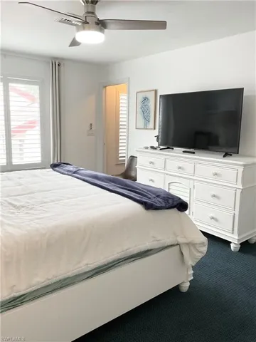 Primary bedroom has large screen smart TV for streaming