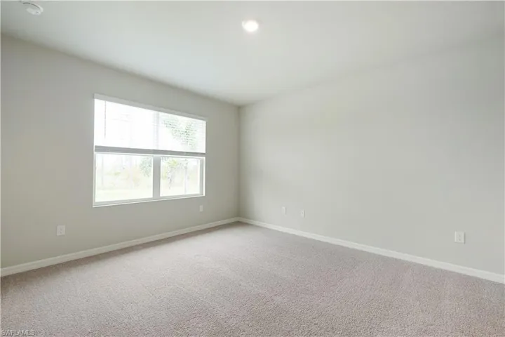 Unfurnished room with carpet