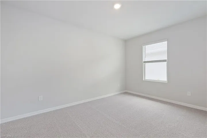 Empty room featuring carpet floors