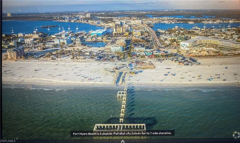 Bird's eye view of expansive coastline and a marina