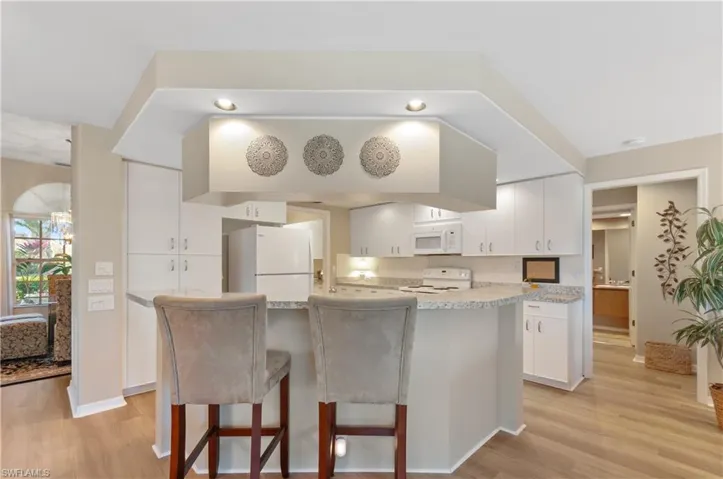 Kitchen has abundance of recessed lighting