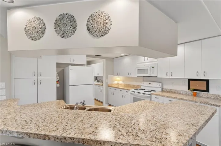 Right of refrigerator is laundry room and entrance to garage