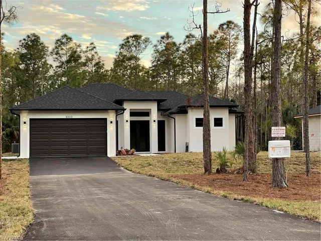 Prairie-style home featuring a garage