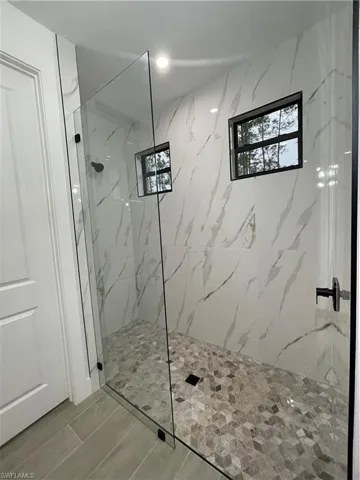 Bathroom with tiled shower