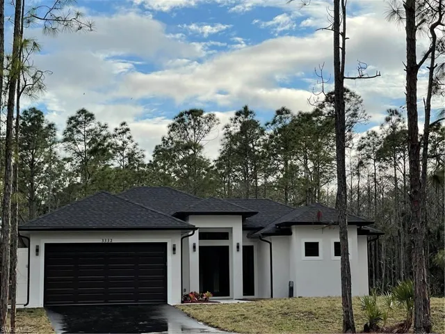 Prairie-style home featuring a garage