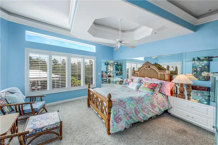 Tray ceiling, transom windows for lots of natural light and plantation shutters are just a few enhancements in this gem.