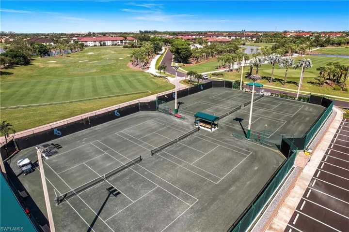 Drone / aerial view of a golf club and a nearby body of water