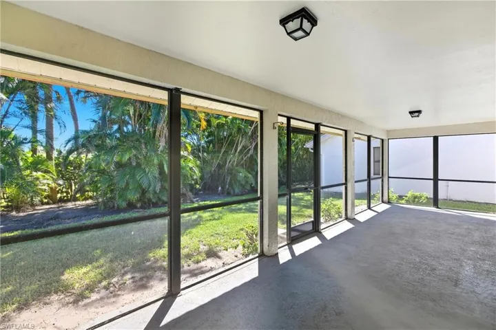 Unfurnished sunroom with concrete floors