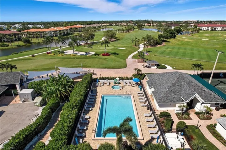 Drone / aerial view of a large body of water and a golf course