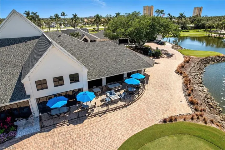 Drone / aerial view of a large body of water and a local golf course