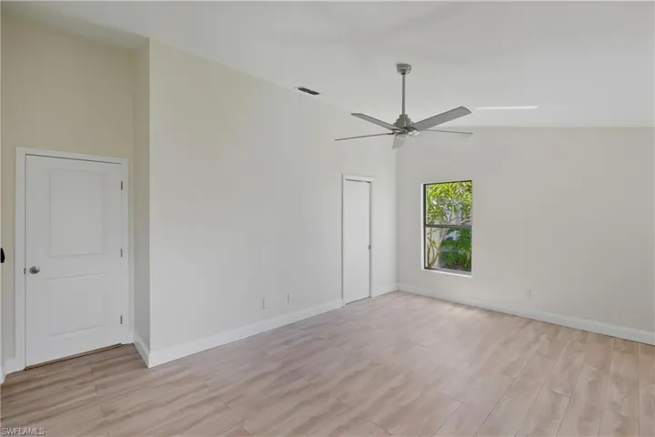 Spare room with light wood-style floors and ceiling fan