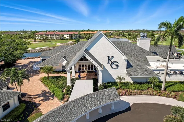 Drone / aerial view of a nearby body of water and a local golf course