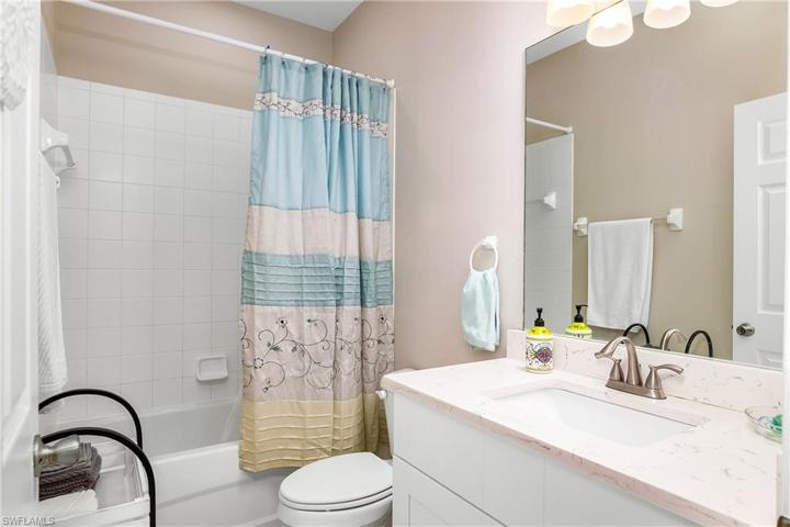 Guest bathroom w/ updated vanity & quartz countertop.