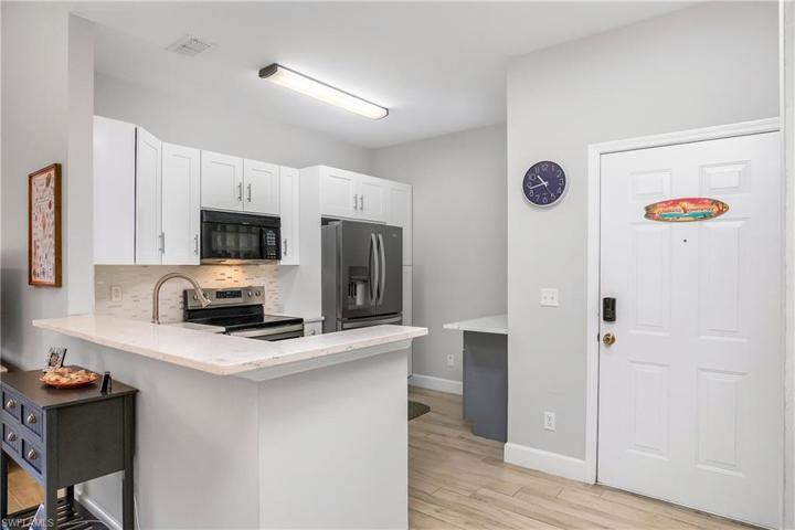 This kitchen is great to entertain in as it opens to the main living area!