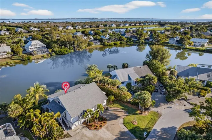 Aerial view of residential area with a large body of water